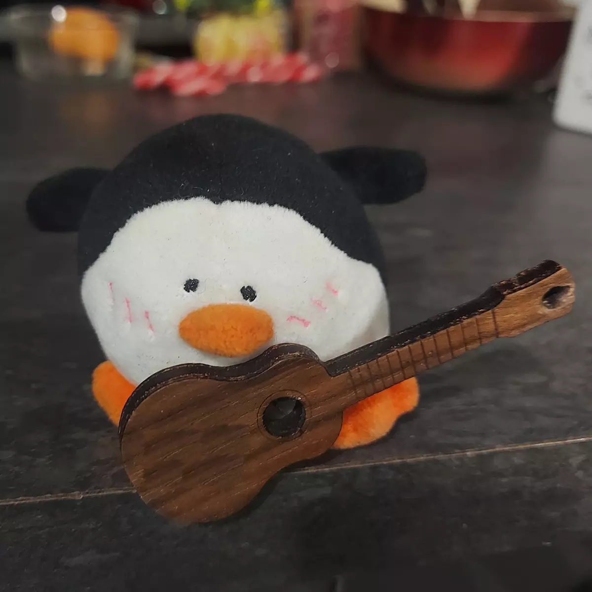 cool penguin playing ukulele